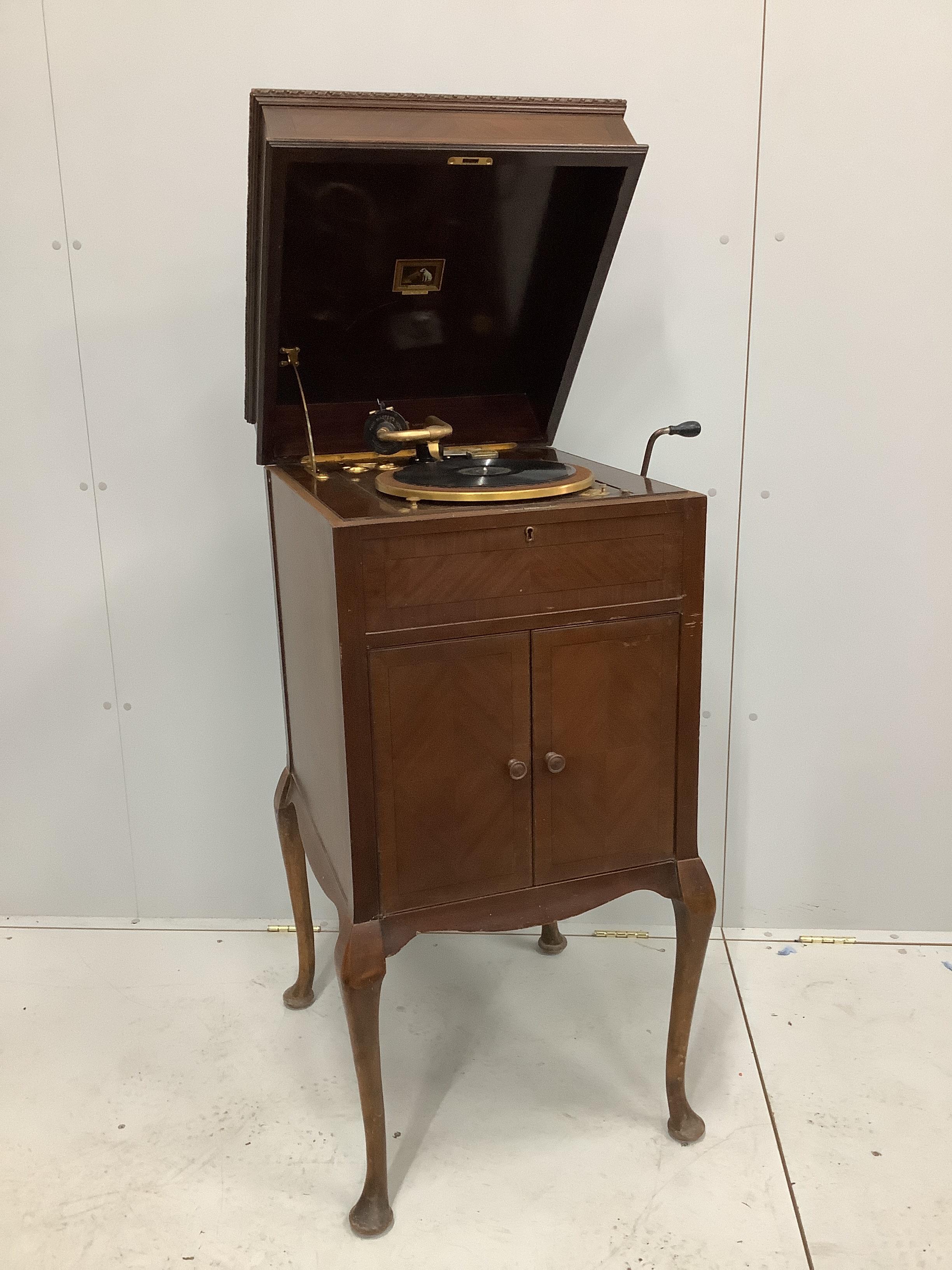 An early 20th century HMV mahogany cabinet, gramophone retailed by Selfridges, model 511, width 52cm, depth 57cm, height 110cm together with approximately sixty records